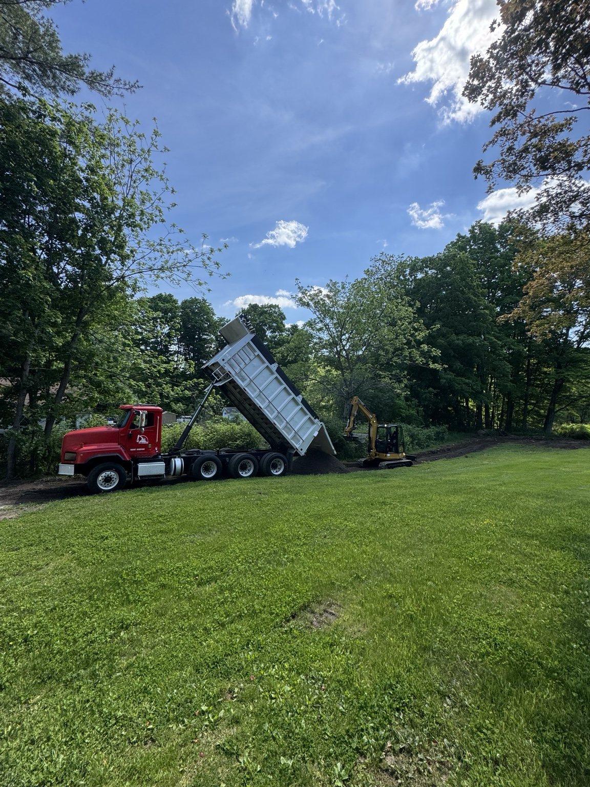 Material delivery and excavation during site work
